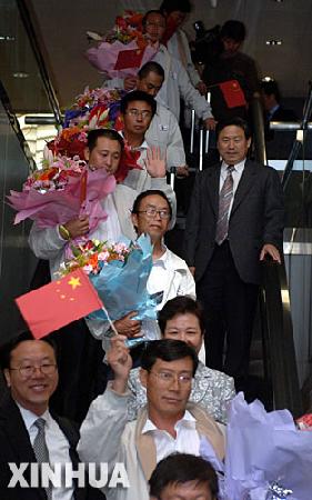 組圖：7名獲釋中方人員抵達北京